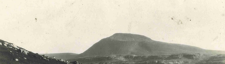 The black and white photo shows the distinctive flat peak of Ingleborough.
