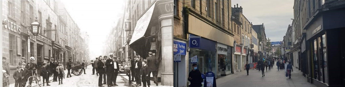 two photos of the same shopping street. In the old one it's thronged with people wearing flat caps or straw boaters. There are hand carts and bicycles, but no other vehicles. The nearest shop has an awning and a large sign in the shape of a canister. Opposite is a pub with a lantern and the name 'Queen's Hotel' in large lettering on the front. In the new photo the shop fronts have been modernised and house major high-street chains, but the upper parts of the stone buildings are unchanged. The street is pedestrianised and a bit less crowded, with no vehicles visible.