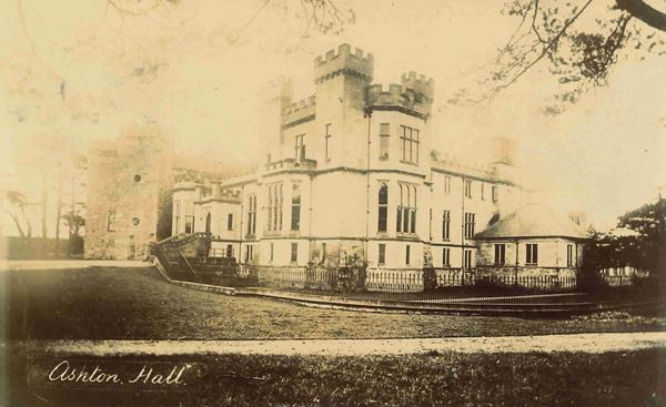 Sepia photo of Ashton Hall around 1905. It's a grand house with leaded windows, several small towers and decorative battlements.