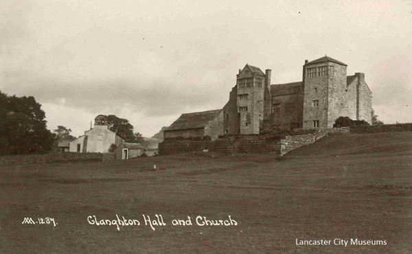 The black and white photo shows the old Claughton Hall. A stone building it dates mainly from around 1600 with mullioned windows and some towers. It looks quite grim and forbidding.
