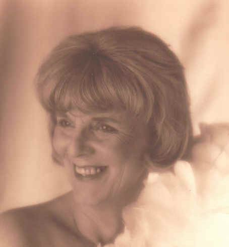 Photo of Lynne Braithwaite. She has blonde hair in a bob and is smiling.