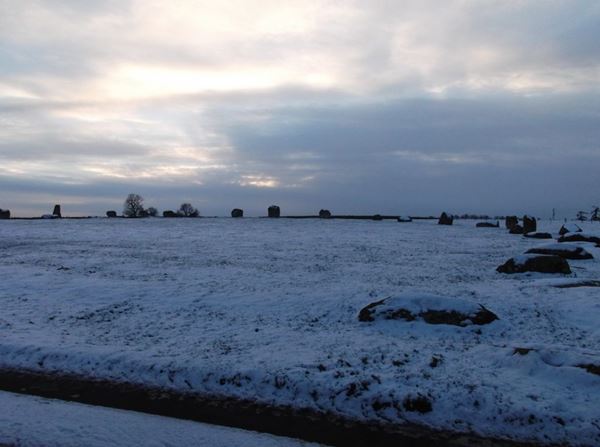 Photo of a stone circle in the snow.