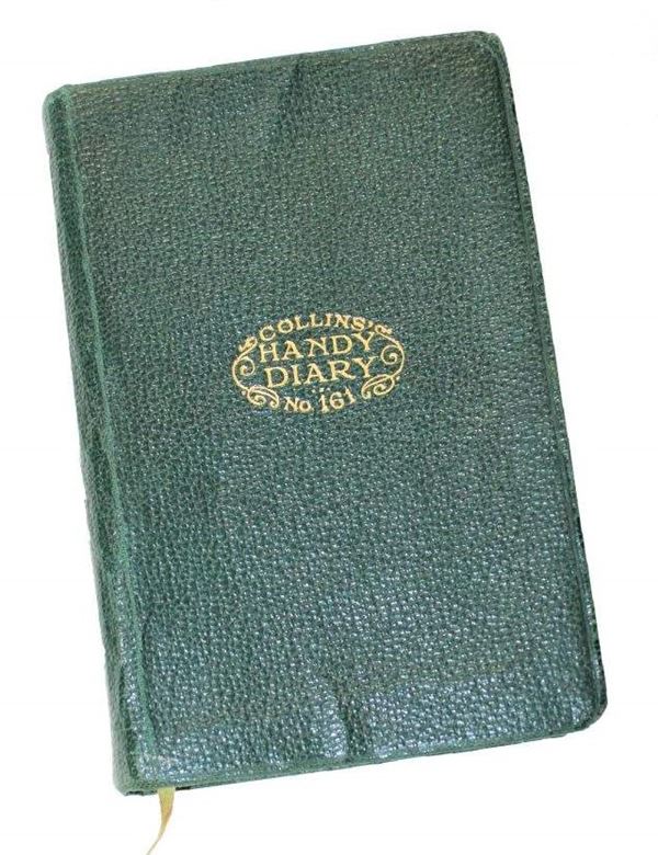 Photo of a green book with the words 'Collins' Handy Diary No.161' embossed in gold on the cover with a small amount of ornamental scrollwork forming an oval shape.