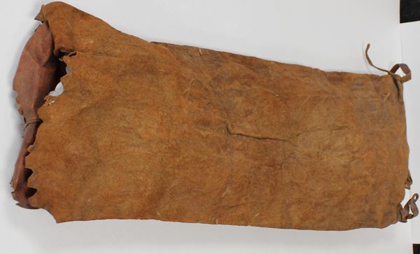 photo of a simple leather bag, open at one end.