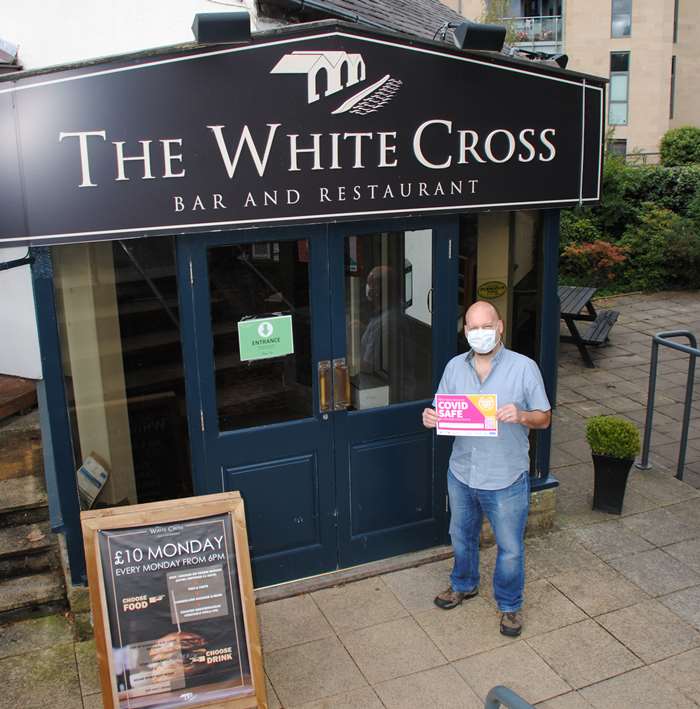 Tim Tomlinson from the White Cross with his Covid Safe certificate