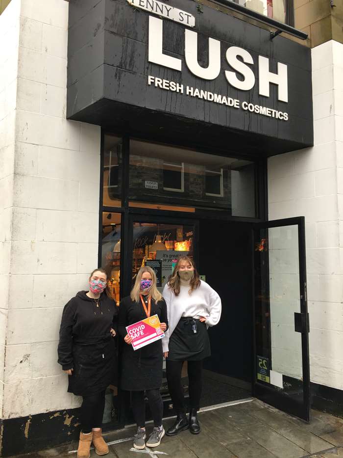Lush employees Jessica Pilgrim, Jayne Antins and Kay McCann with their Covid Safe certificate.